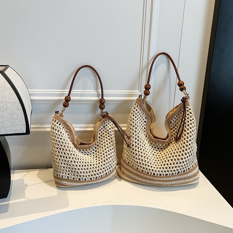 2025 Summer Woven Beach Bag for Women, Hollow Hand-Held Tote, Stylish Shoulder Crossbody for Commuting and Vacation 2025 Summer Woven Beach Bag for Women, Hollow Hand-Held Tote, Stylish Shoulder Crossbody for Commuting and Vacation