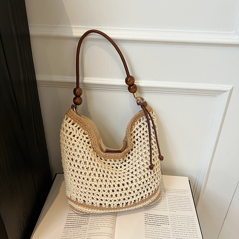 2025 Summer Woven Beach Bag for Women, Hollow Hand-Held Tote, Stylish Shoulder Crossbody for Commuting and Vacation 2025 Summer Woven Beach Bag for Women, Hollow Hand-Held Tote, Stylish Shoulder Crossbody for Commuting and Vacation