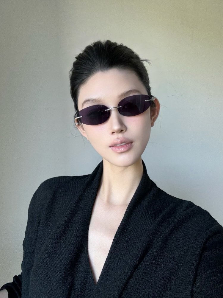 Retro Frameless Purple Small Oval High-End Sunglasses for Trendy Girls - European American Style, Perfect for Small Faces and Street Photography.