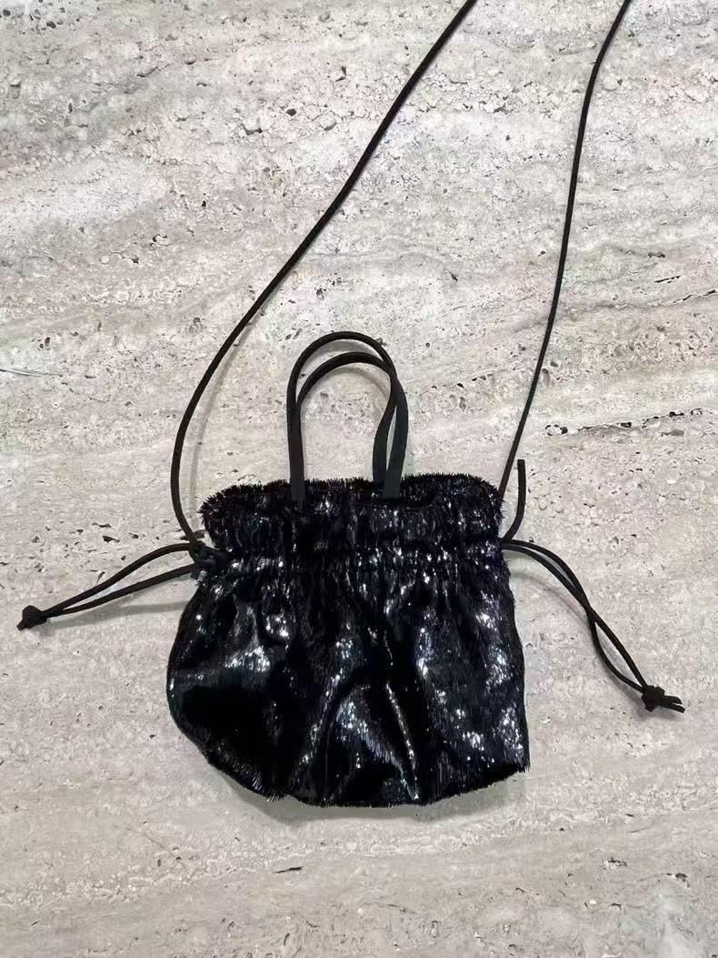 Trendy 2025 Soft Sculpture Mini Bag with Shiny Tassels and Drawstring Closure - Versatile Fashion Accessory Trendy 2025 Soft Sculpture Mini Bag with Shiny Tassels and Drawstring Closure - Versatile Fashion Accessory