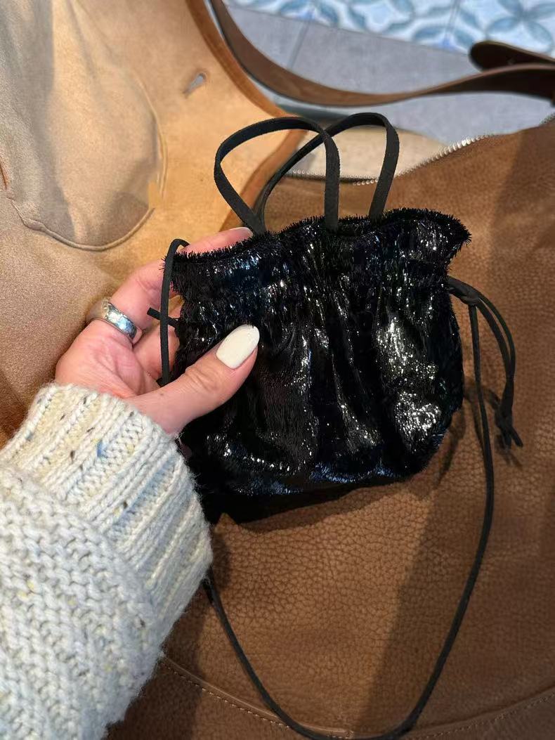 Trendy 2025 Soft Sculpture Mini Bag with Shiny Tassels and Drawstring Closure - Versatile Fashion Accessory Trendy 2025 Soft Sculpture Mini Bag with Shiny Tassels and Drawstring Closure - Versatile Fashion Accessory