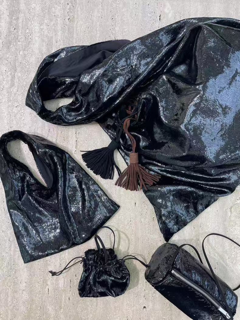 Trendy 2025 Soft Sculpture Mini Bag with Shiny Tassels and Drawstring Closure - Versatile Fashion Accessory Trendy 2025 Soft Sculpture Mini Bag with Shiny Tassels and Drawstring Closure - Versatile Fashion Accessory