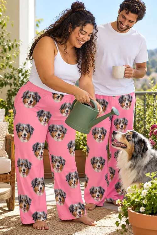Couple in pink Australian shepherd pajama pants watering plants on a sunny balcony while their dog looks up