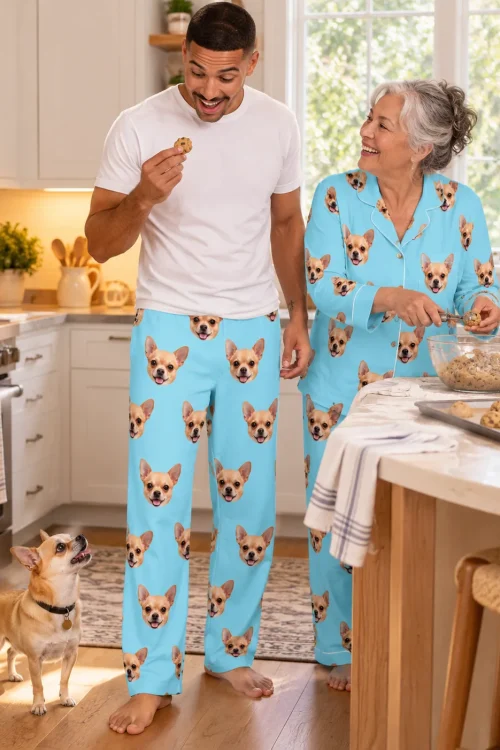 Man and a woman baking cookies in a kitchen in light blue chihuahua pajamas as the dog begs