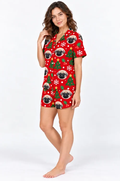 Christmas pajama set with pet face print, 3/4 view, one hand at her hair