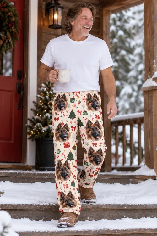 Older man with a mug stepping down snowy porch stairs in cream Christmas pajama pants with dog faces