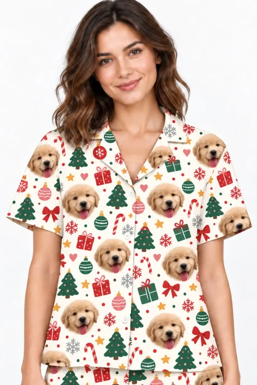 Close-up of the cream Christmas pajama shirt: puppy faces, trees and candy canes