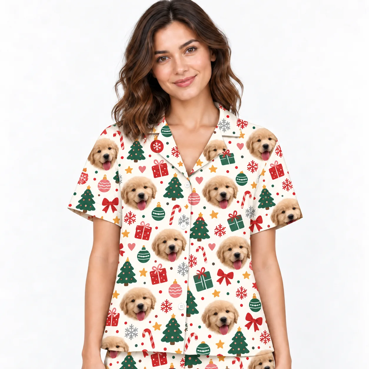 Close-up of the cream Christmas pajama shirt: puppy faces, trees and candy canes