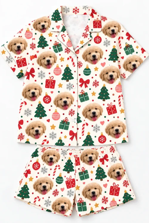 Cream Christmas pajama set with pet face print laid flat, shirt above the shorts