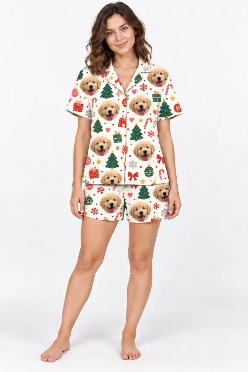 Woman in a cream Christmas pajama set: golden puppy faces with trees, ornaments and gifts