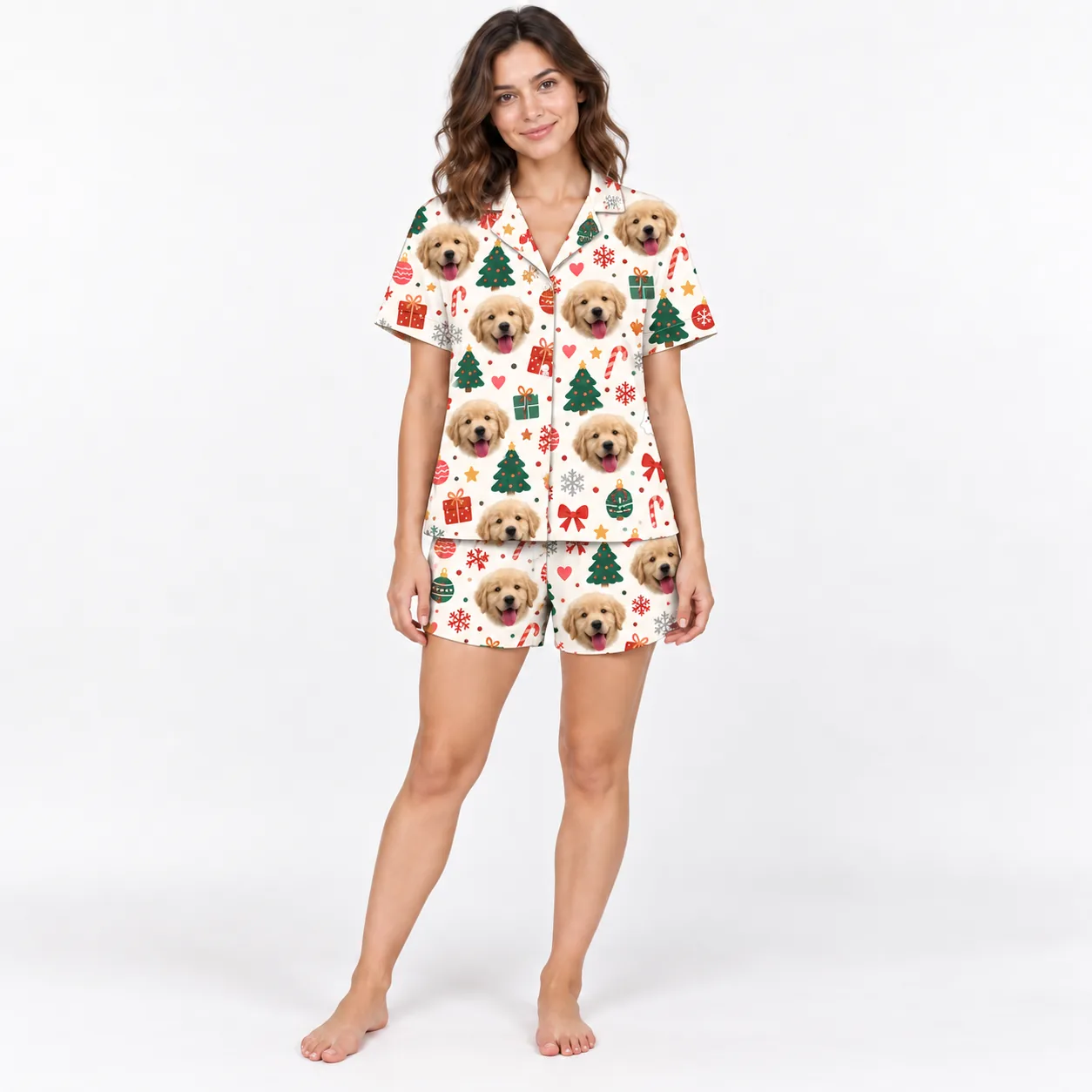 Woman in a cream Christmas pajama set: golden puppy faces with trees, ornaments and gifts