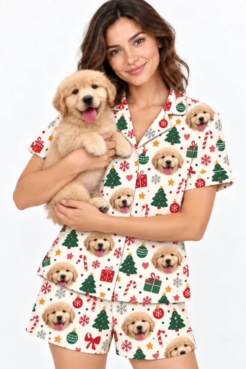 Woman holding her golden puppy in a cream Christmas pajama set printed with its face