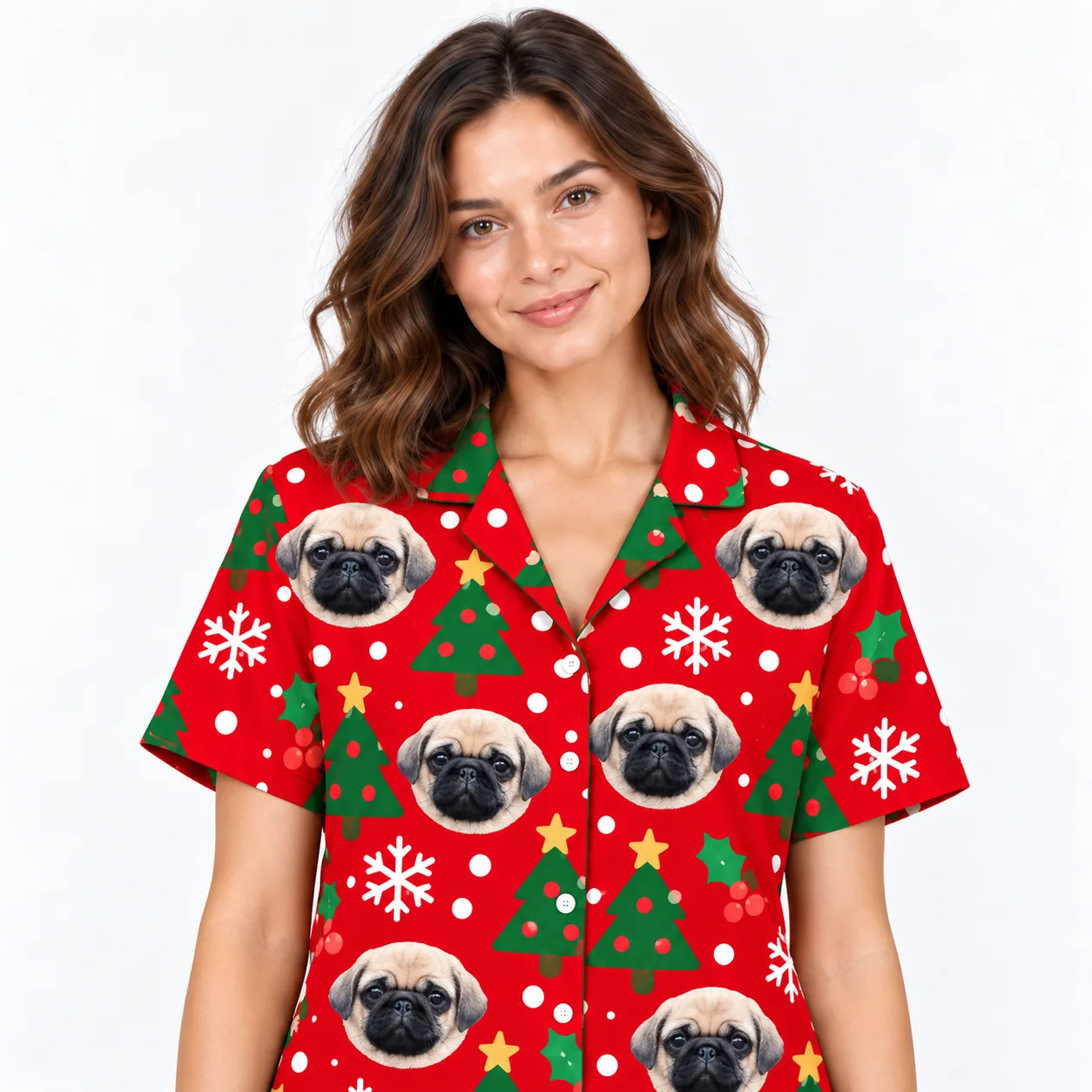 Close-up of a red pajama shirt collar and buttons with printed pug dog faces and trees