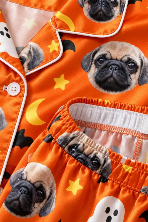Detail of the satin pet pajama set: button, piping and inside of the elastic waistband