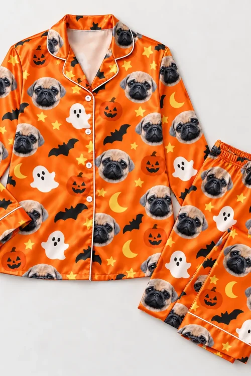 Satin custom pet pajama set laid flat: button shirt and long pants with pug faces
