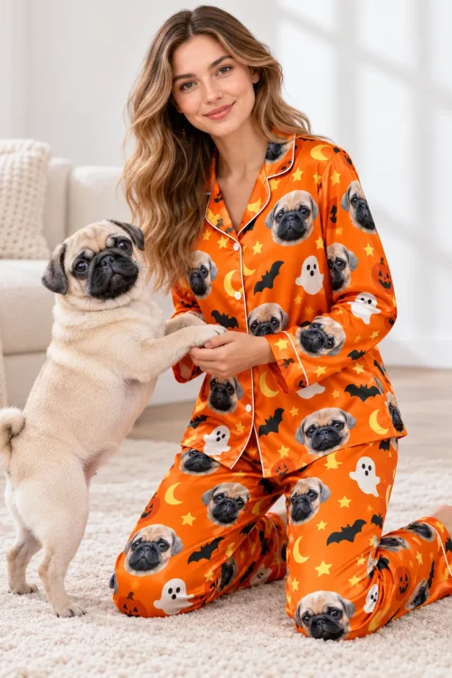Pug standing up against a woman kneeling in a satin custom pet pajama set