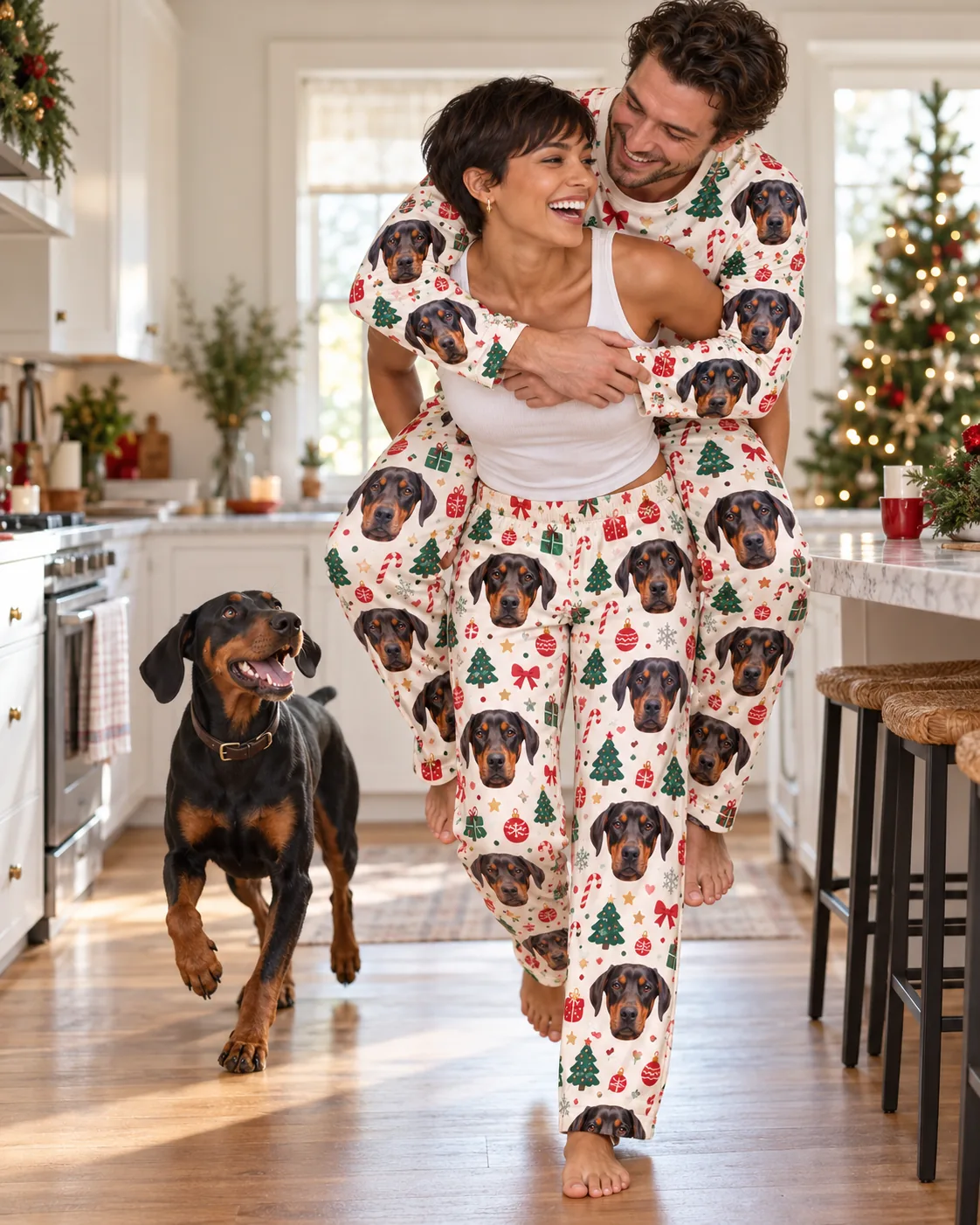 Custom Doberman Pajama Pants for Women — christmas cream family | GenzOutfit Couple in Christmas cream doberman pajamas on a piggyback ride in the kitchen as the dog trots over