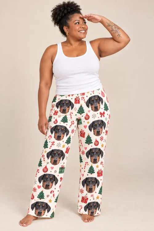 Woman shading her eyes in Christmas cream doberman pajamas for women with trees and candy canes