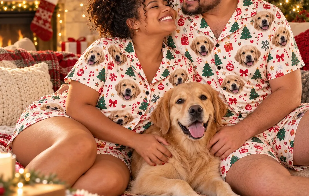 Couple in matching Christmas pajamas printed with their golden retriever photo, sitting with the dog, dog Christmas gifts
