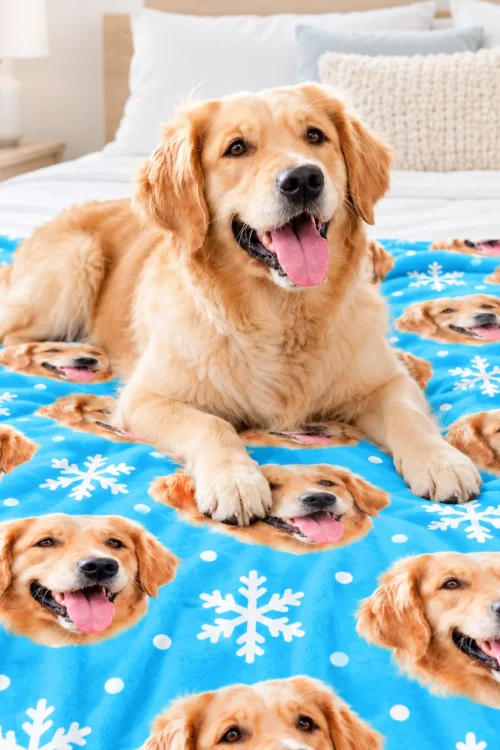 Golden retriever lying on its own dog face fleece blanket