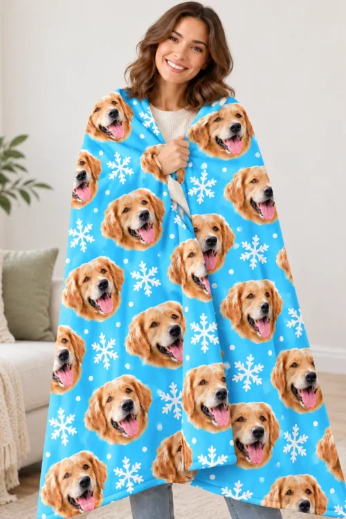 Woman wrapped in the blue dog face fleece blanket with golden retriever print