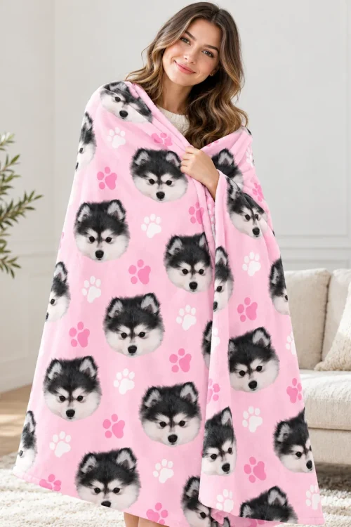 Woman wrapped in the pink dog face minky blanket with husky puppy print
