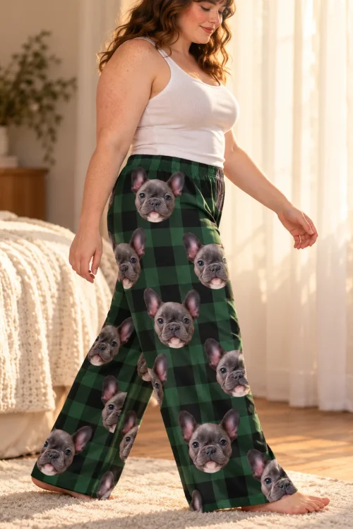 Woman walking through a sunny bedroom in green plaid pajama pants covered in French bulldog faces
