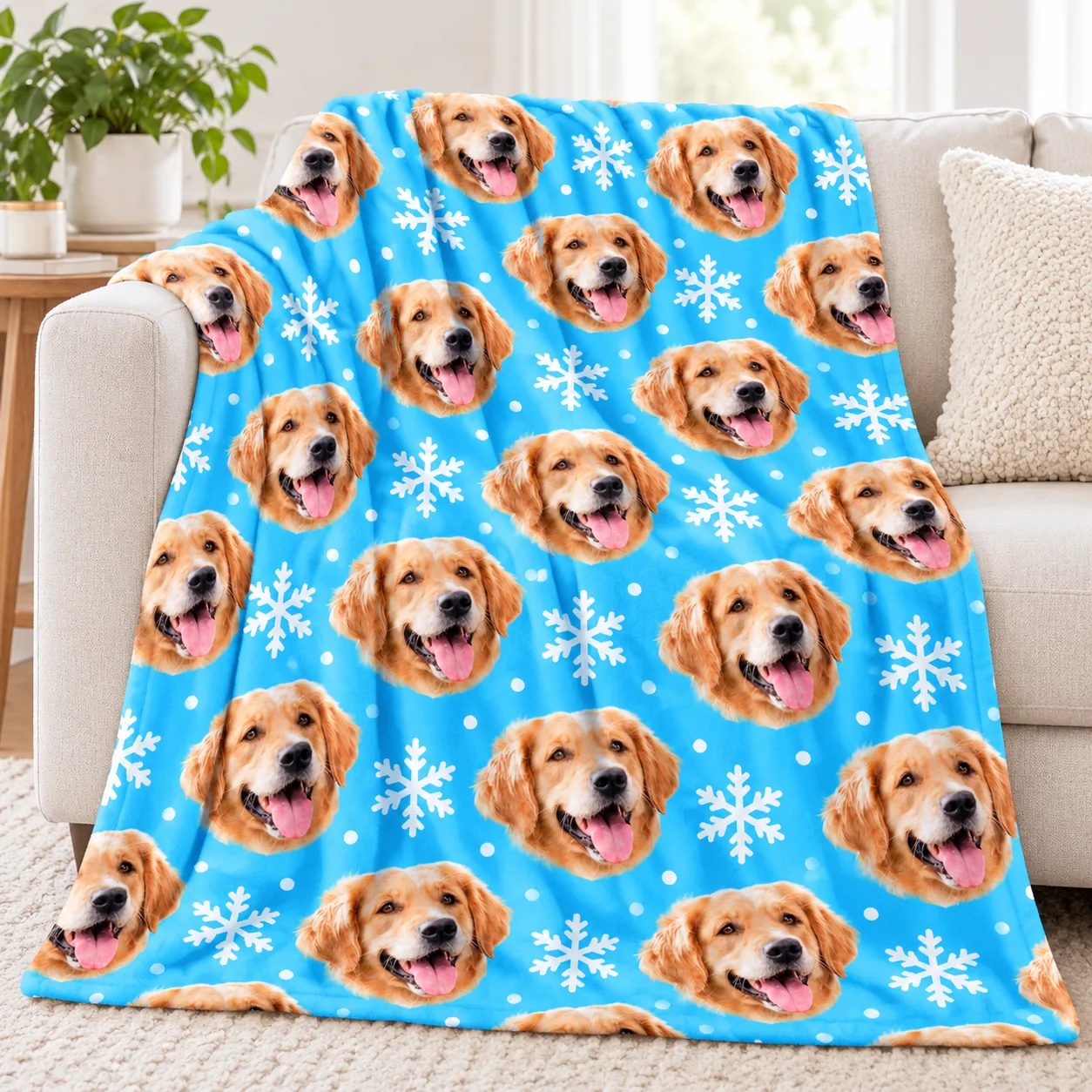 Blue fleece pet blanket printed with a golden retriever's face, draped over a sofa