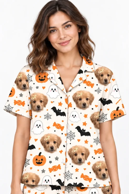 Close-up of the Halloween pajama shirt: puppy faces, pumpkins, ghosts and bats