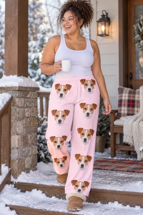 Woman with a mug on a snowy porch in blush pink Jack Russell loungewear and fuzzy boots