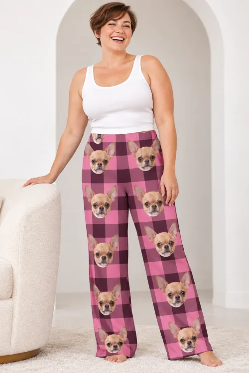 Laughing woman beside a cream chair under an arch in pink plaid ladies chihuahua pajamas