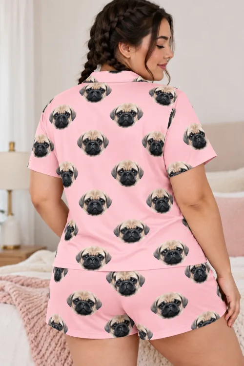 Back view of a woman with braids in a light pink pajama set covered in pug faces in a bedroom