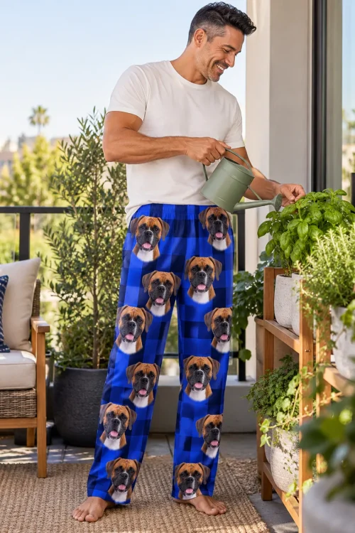 Man watering balcony herbs in blue plaid mens boxer dog pajamas