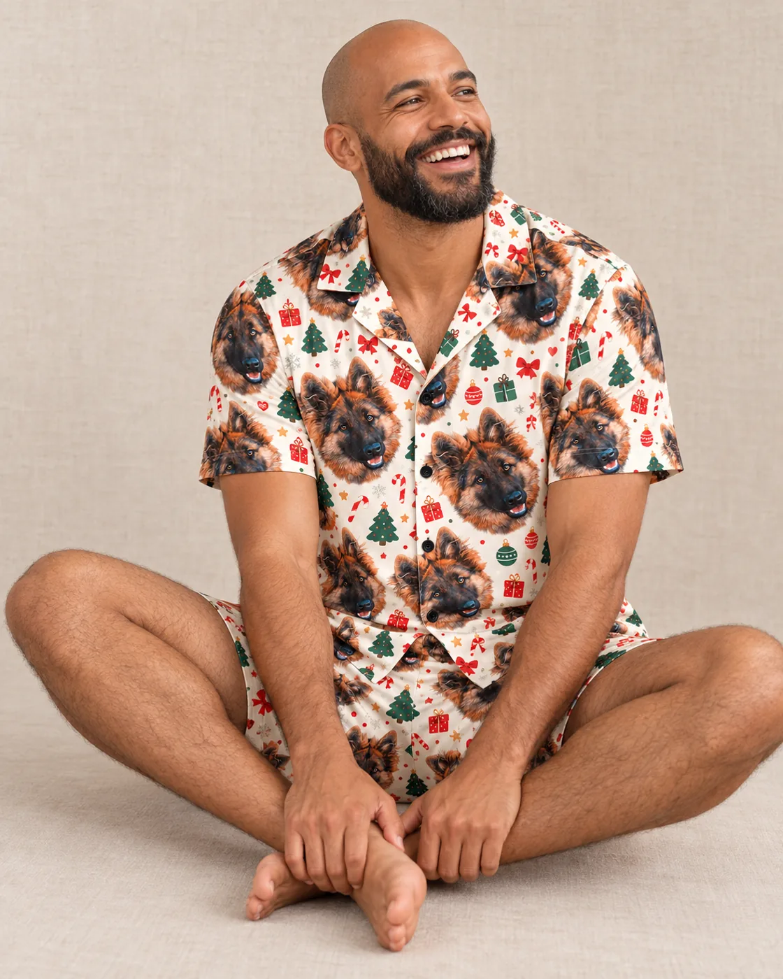 Men's Christmas pajamas: smiling man in a Christmas Cream short set printed with German shepherd faces