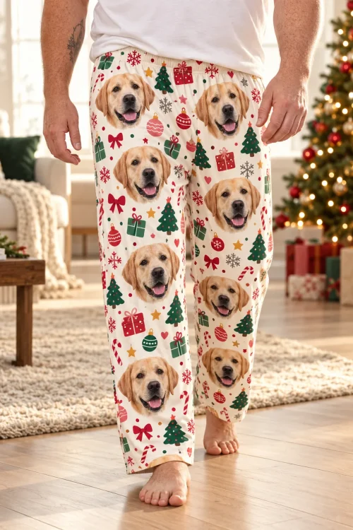 Close view of Christmas cream labrador pajama pants with trees and gifts, walking past a lit tree