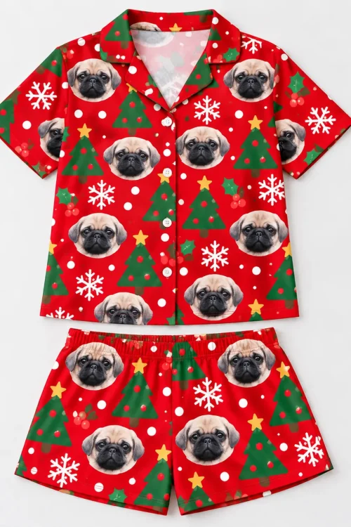 Red Christmas pajama set with pet face print laid flat, shirt above the shorts