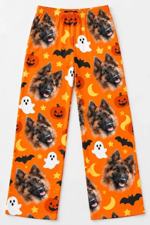 Men's pet face pajama pants laid flat: German shepherd faces, pumpkins, bats and moons