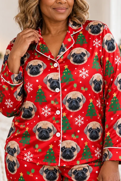Close-up of the red satin christmas pajama shirt: pug faces, trees, snowflakes, white piping