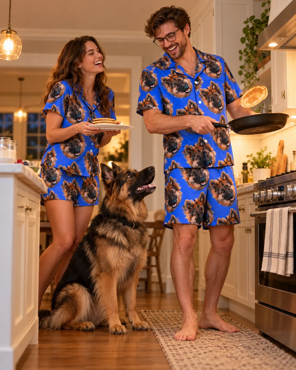 Short pajama set: couple in royal blue short sets with German shepherd faces making pancakes with their dog