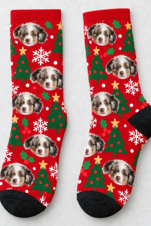 Socks with dog face print laid flat on a light background, black heel and toe
