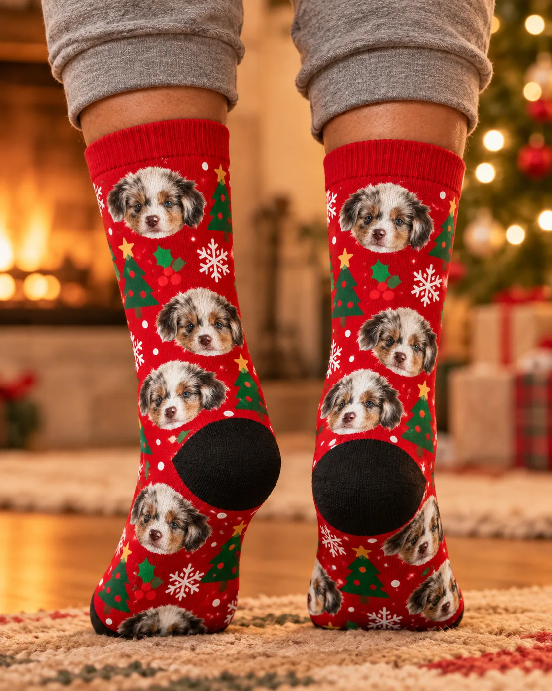 Heels by a fireplace and Christmas tree in red holiday socks with puppy faces