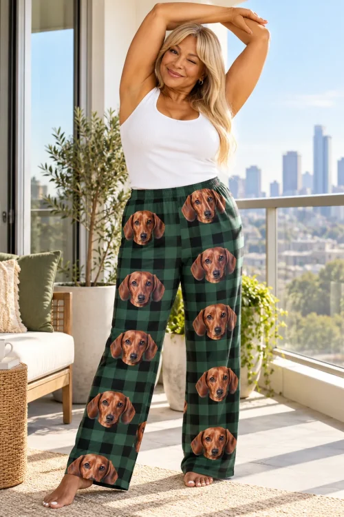 Blonde woman stretching and winking on a city balcony in green plaid dachshund pajamas for women