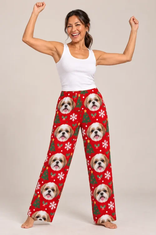 Woman cheering with raised arms in red Christmas women's shih tzu pajamas with trees and snowflakes